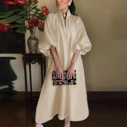 Chic and stylish women’s ankle-length maxi dress in white, featuring a v-neck and loose fit, perfect for elevating any casual to semi-formal wardrobe.