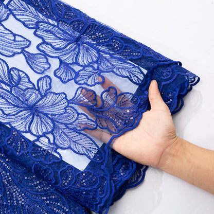 Close-up of exquisite embroidered lace featuring sparkling sequins, ideal for creating elegant Nigerian wedding dresses in a 51-52 inch width.