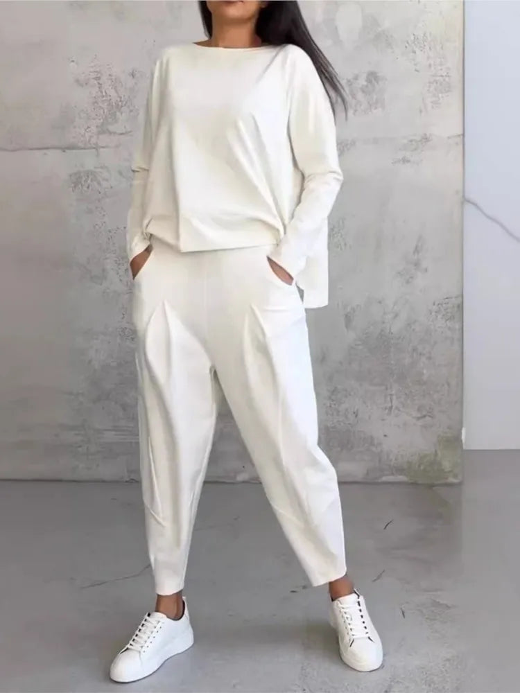 Elegant women's casual loose sports set featuring a sophisticated long sleeve irregular top paired with high waist harem pants, perfect for a chic autumn/winter look.