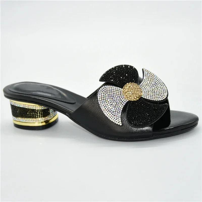 Dazzling pair of women's slingback sandals, embellished with intricate metal decorations and rhinestones, offering both elegance and comfort.