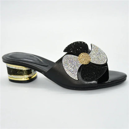 Dazzling pair of women's slingback sandals, embellished with intricate metal decorations and rhinestones, offering both elegance and comfort.