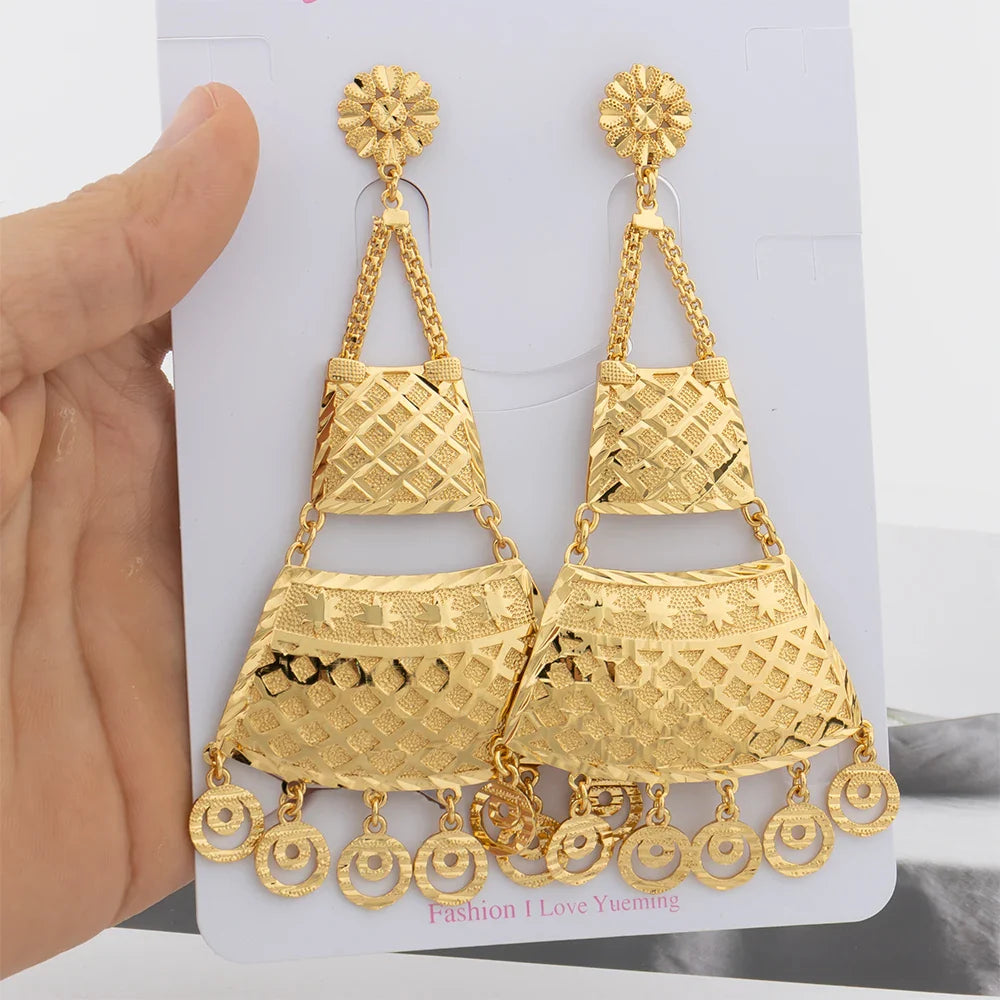 Chic 18K gold coloured earrings showcasing a bold copper tassel, perfect for adding a touch of luxury to your daily ensemble.