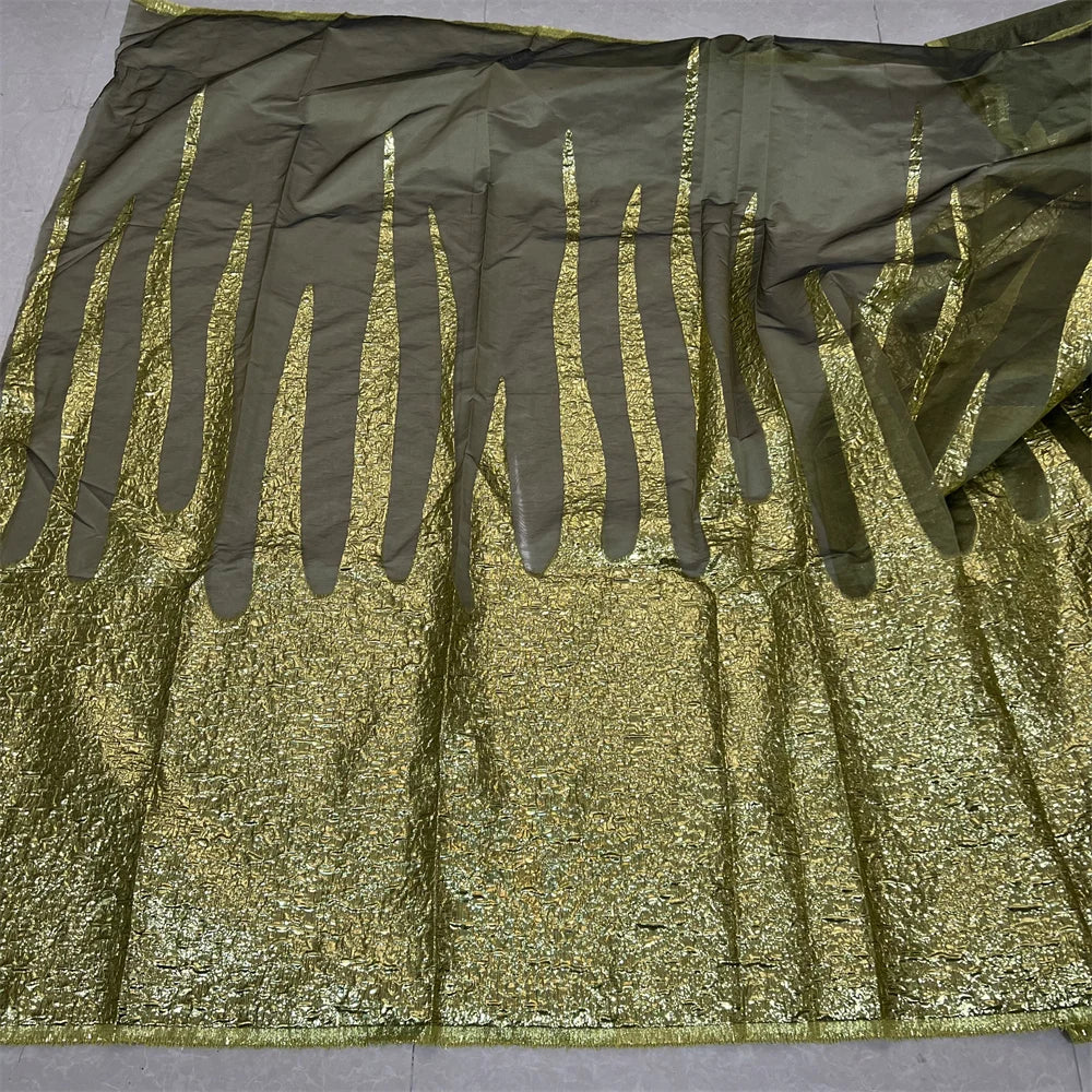 Close-up of luxurious lace fabric with intricate embroidery, ideal for bridal gowns and special occasions, captured in a soft light.