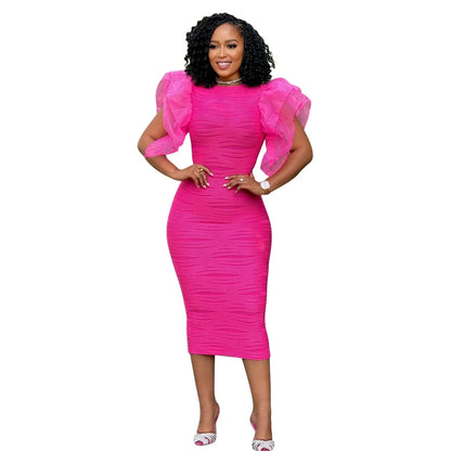 Fashionable view of the slim fit and O-neck design of CM.YAYA women's striped dress, defining modern elegance.