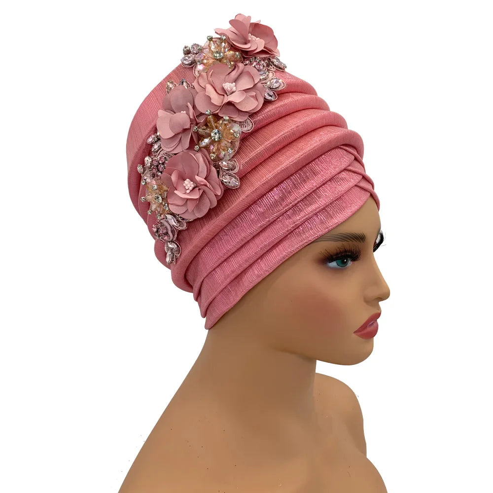Elegant African women's turban cap adorned with a diamond flower design, perfect for luxurious occasions.