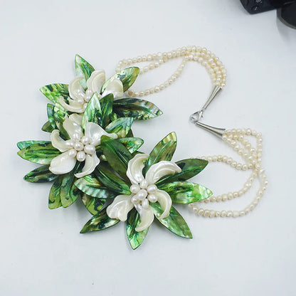 Close-up view of a fashionable shell flower necklace for weddings, showcasing intricate designs and glistening crystals for an opulent look.