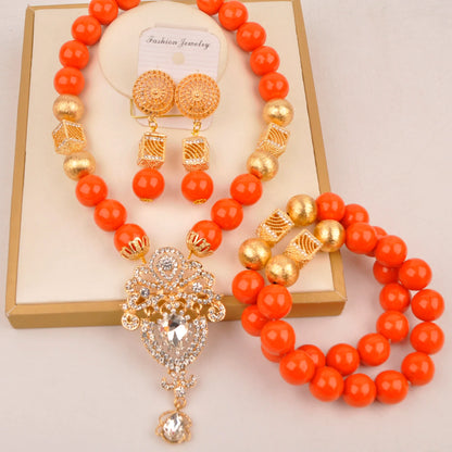 Full display of the complete Nigerian bridal jewelry set including necklace, bracelet, and earrings made with artificial coral beads, epitomising elegance for brides.
