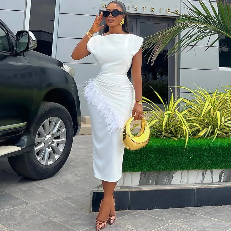 Refined O-neck women’s dress with a slim fit and feather embellishments, exuding elegance and professionalism for office attire.