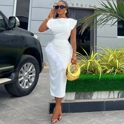 Refined O-neck women’s dress with a slim fit and feather embellishments, exuding elegance and professionalism for office attire.