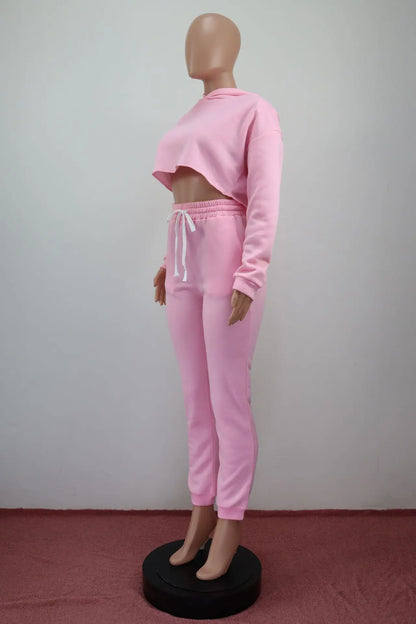 Model wearing the luxury women's long sleeve cropped hoodie and jogger tracksuit, demonstrating the comfortable and stylish fit.