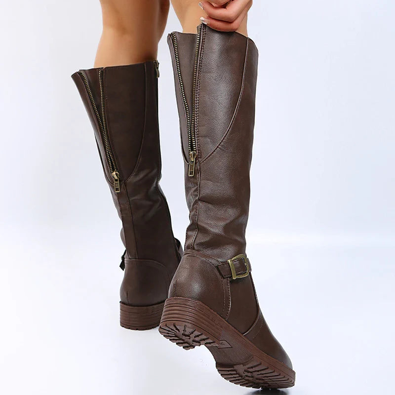 Stylish long boots for women, crafted from high-quality PU leather with a contemporary square heel and decorative buckle, perfect for elegant winter outings.