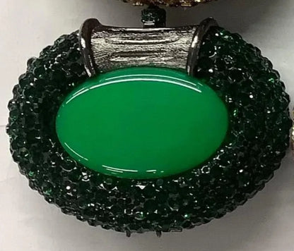 Luxury women's metallic clutch bag adorned with crystals, perfect for elegant evening events and parties.