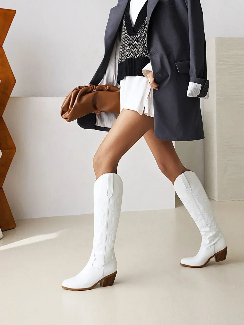 Elegant brown PU leather knee high pointed toe knight boots for women, featuring a stylish western cowboy design, perfect for both casual and sophisticated occasions.