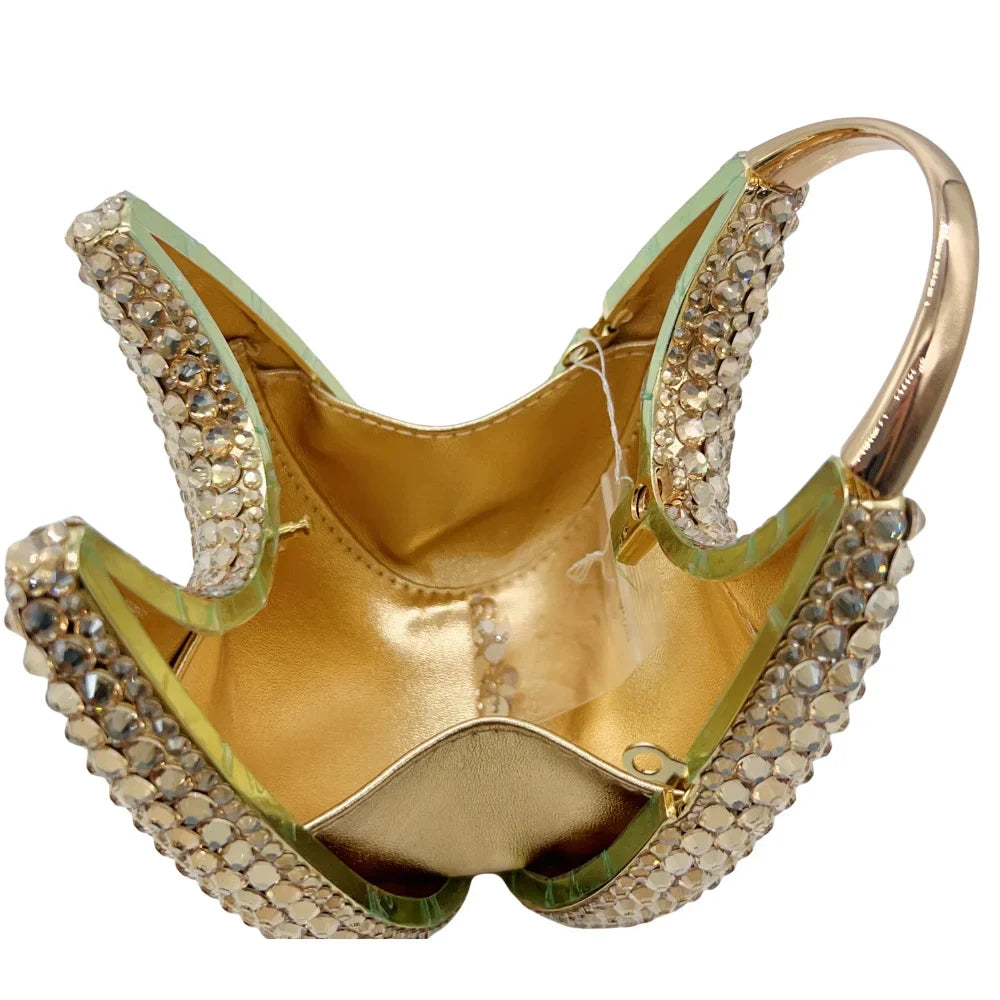 Chic women's minaudiere clutch bag in a solid metallic hue, ideal for evening wear and special occasions, showcasing elegant simplicity.