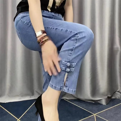 Chic close-up of high-quality polyester denim fabric, highlighting the thin texture and casual aesthetic of the women's ankle-length trousers.