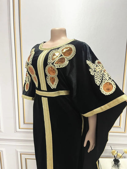 Long view of the luxurious Dubai dress highlighting its graceful flow and vibrant golden hue, perfect for formal events.