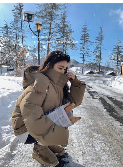 Close-up view of the luxurious zipper and high-quality fabric on the hooded down cotton jacket, showcasing its exquisite design and functionality.