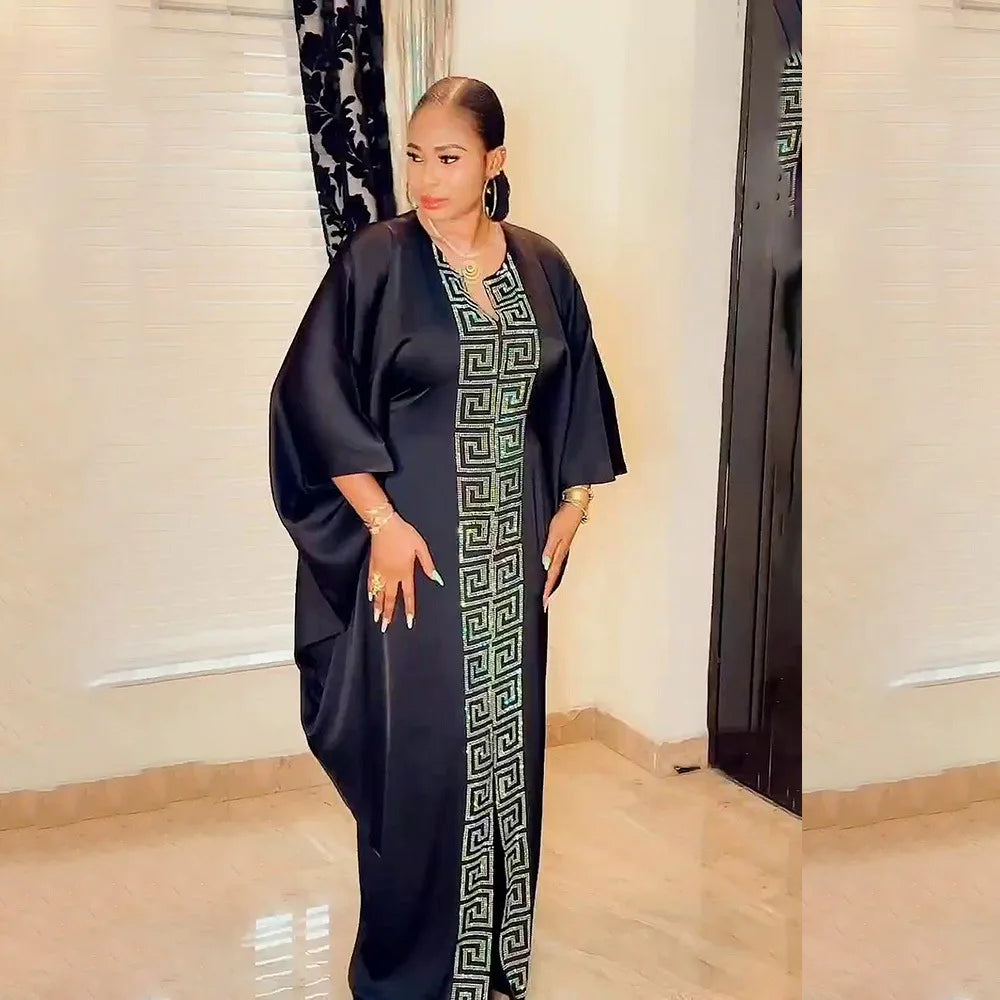 Back view of the elegant plus size African bat sleeve V-neck maxi dress with flowing silhouette, highlighting its loose fit and modern stylish appeal.