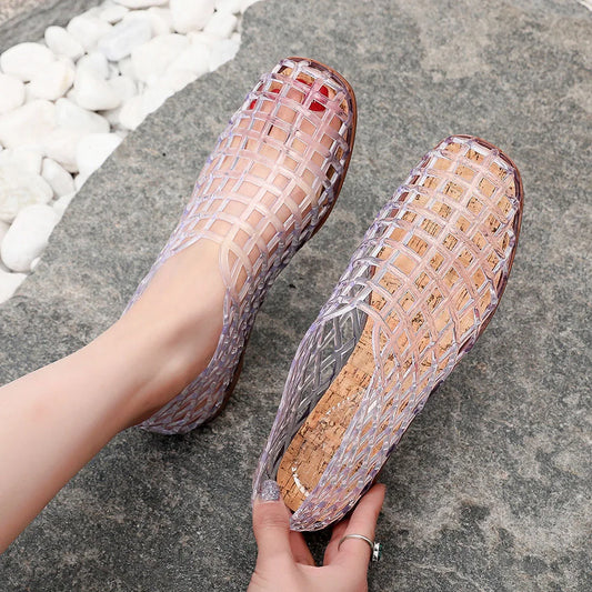 Elegant women's flat jelly sandals with a chic open toe design, perfect for summer casual wear.
