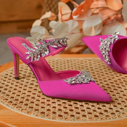 Fashion-forward pointed toe silk mules sandals adorned with sparkling rhinestones, embodying luxury and comfort for the summer season.