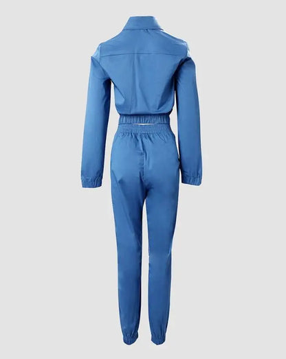 Close-up of the stylish high waist pants from the elegant two-piece denim tracksuit for women, showcasing premium polyester fabric and solid colour.