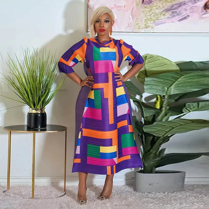 Model wearing the elegant African plus size O-neck pleated long dress, highlighting its flattering fit and stylish design.