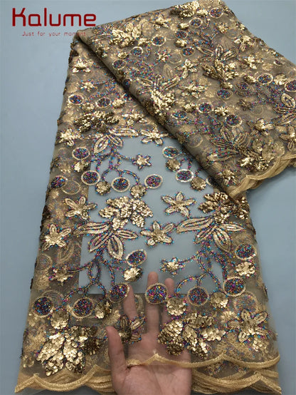 A stunning display of Kalume African lace fabric adorned with rhinestones, perfect for creating high-end fashion pieces for special occasions.