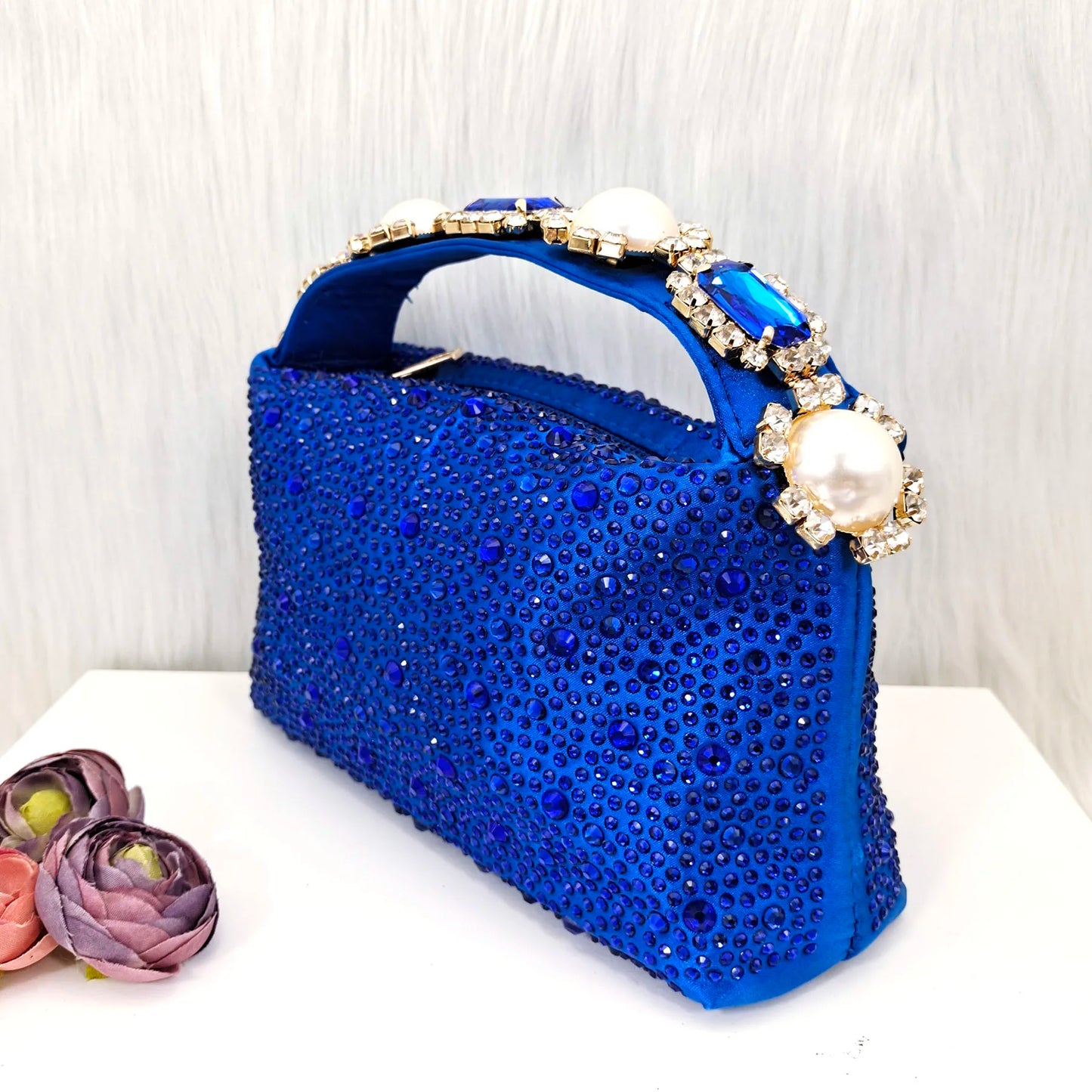 Luxurious Italian design blue stiletto heels sandals adorned with rhinestones and pearls, showcasing an elegant silhouette suitable for women.