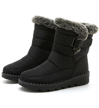 Inside view of luxury waterproof ankle snow boots for women, featuring soft plush insole and fine craftsmanship for ultimate comfort and style.