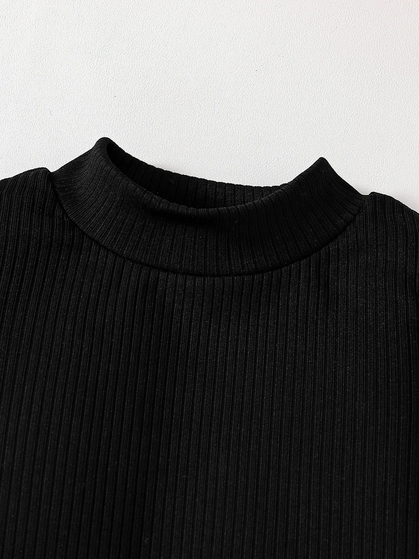 Luxurious girls' autumn fashion set featuring an off-shoulder turtleneck top and half skirt, designed for ages 4-6, in elegant solid colour.