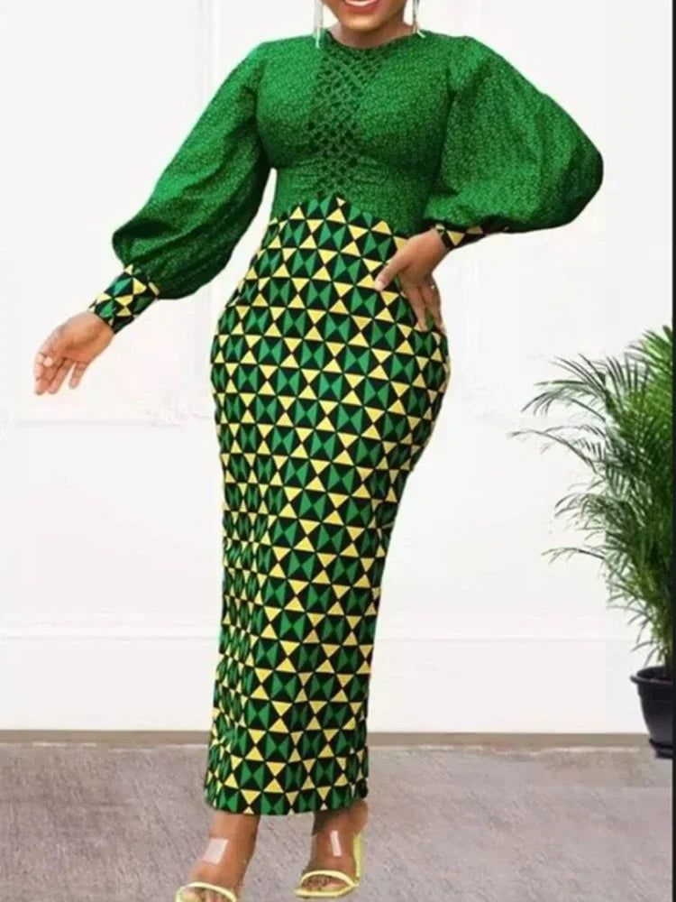 Close-up of the exquisite fabric details of the Dashiki maxi dress, highlighting intricate African patterns and luxurious polyester.