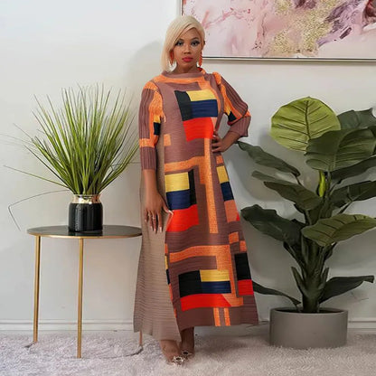 Beautifully designed African Plus Size pleated long dress in vibrant orange, capturing the essence of luxury and tradition.
