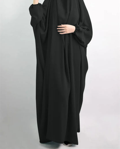 Elegant Muslim abaya dress for women crafted from casual polyester fabric with slight stretch, showcasing timeless sophistication and versatility for any occasion.