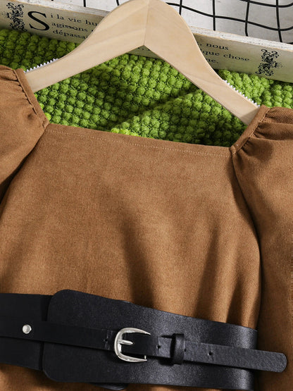 Gorgeous knee-length pleated dress for girls, combining a stylish silhouette with plush puff sleeves, exuding elegance and charm.