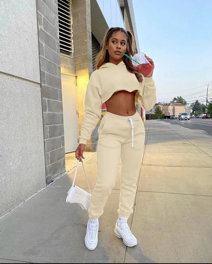 Luxury jogger tracksuit from the women's pink fleece running set, displaying its comfortable fit and chic spliced design.