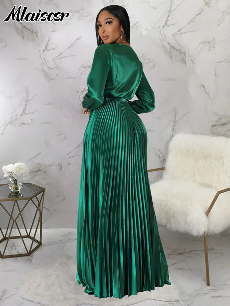 Model wearing Mlaiscsr Women's Pleated Swing Dress at an autumn wedding, capturing elegance with a flattering V-neckline and flowing fabric.