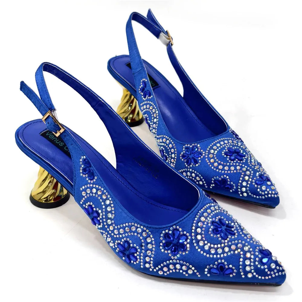 Stylish fashionable women's bag with metallic handle and chain strap, designed to complement fuchsia high heels.