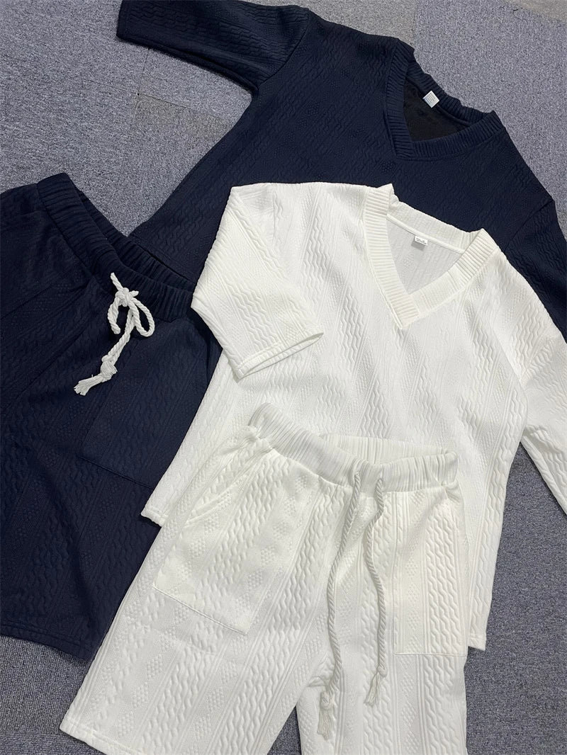 Luxurious men's knitted casual summer outfit set featuring a stylish V-neck t-shirt and elegant drawstring shorts, perfect for sophisticated daily wear.