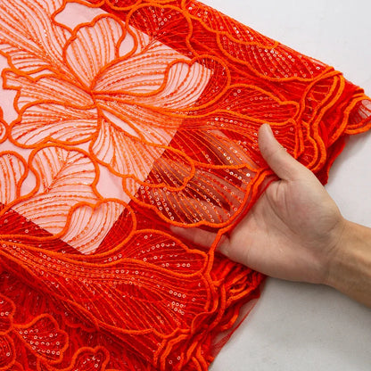 Exquisite lace fabric with a shimmering finish, perfect for formal bridal attire, showcasing artistry in embroidery for a luxurious wedding experience.