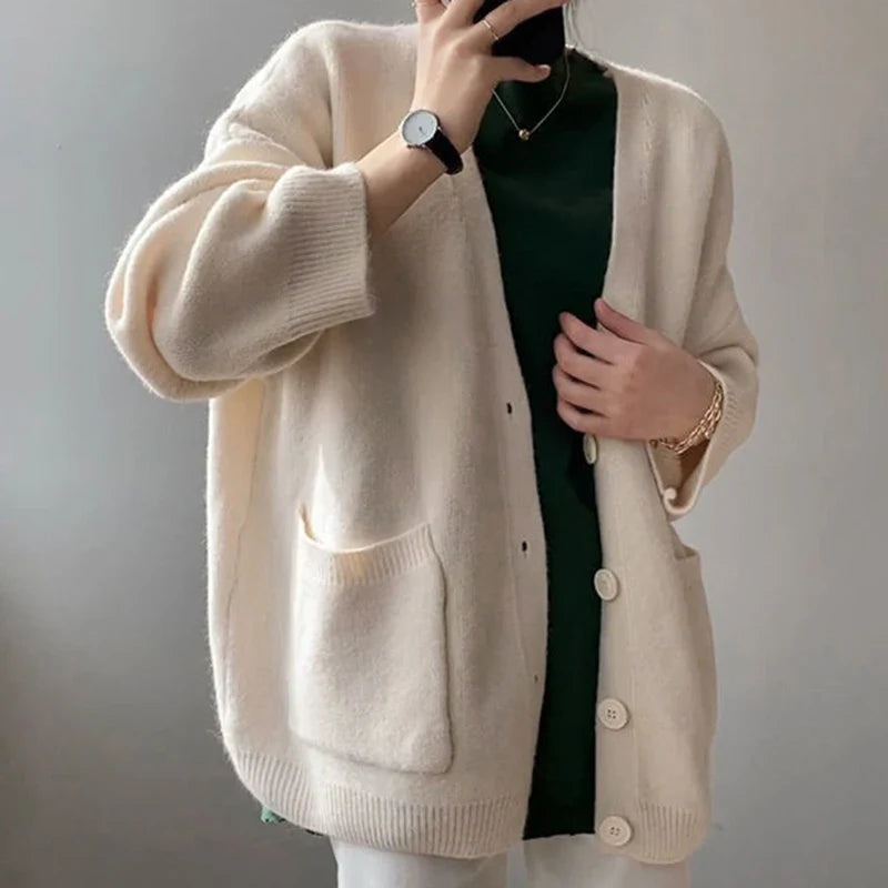 Chic yellow knitted cardigan for women featuring a luxurious loose fit, V-neck, and single-breasted design, perfect for autumn and winter styling.