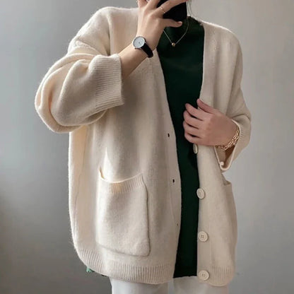 Chic yellow knitted cardigan for women featuring a luxurious loose fit, V-neck, and single-breasted design, perfect for autumn and winter styling.