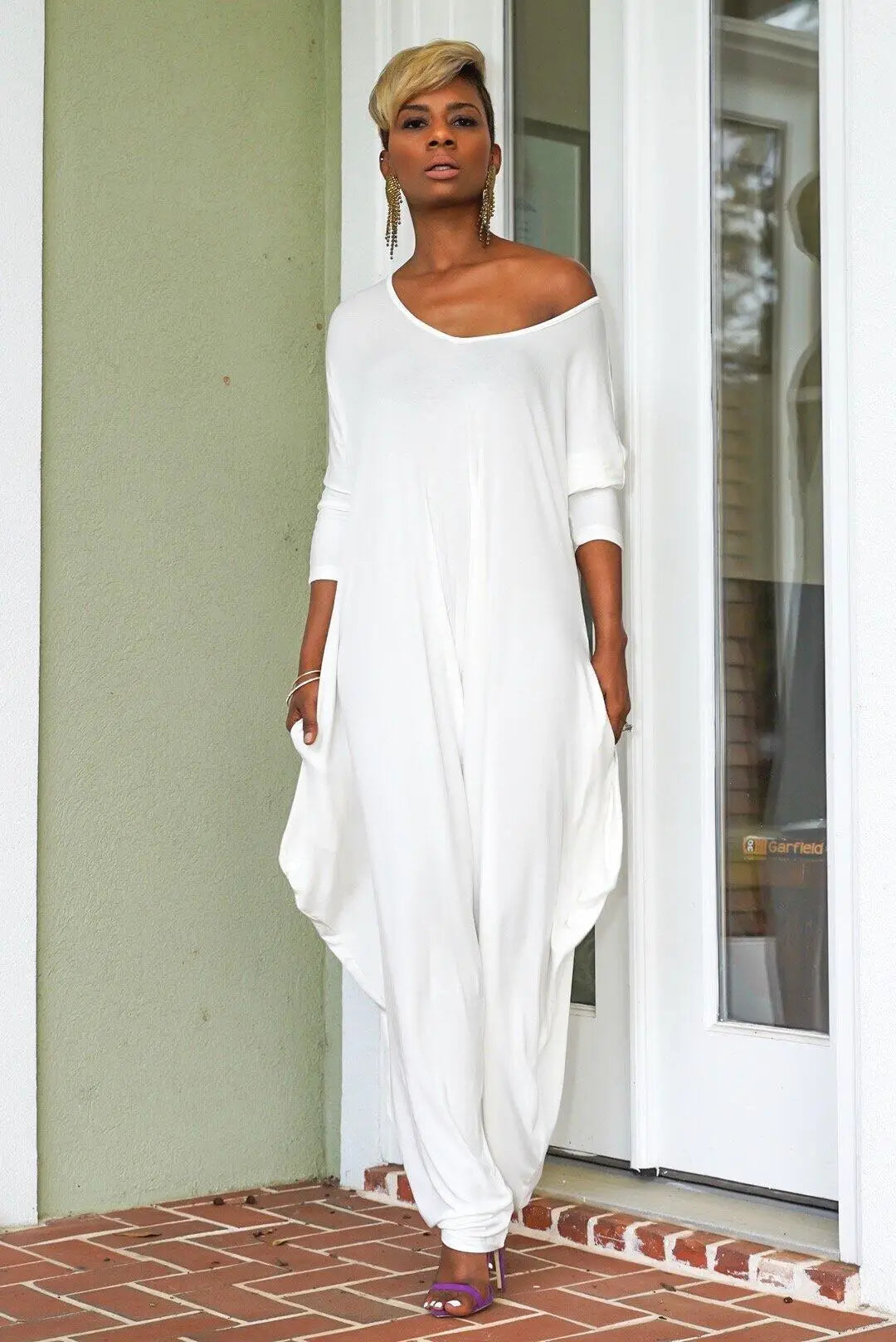 Stylish back view of an elegant women's jumpsuit, showcasing the loose fit and sophisticated wide leg silhouette.