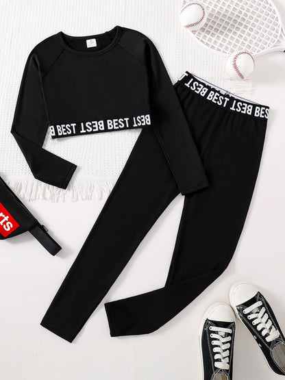 Chic girls' 2-piece fashion set featuring an elegant English print round neck long sleeve top and stylish slim fit black pants for ages 7-13, ideal for autumn with a thin polyester material.