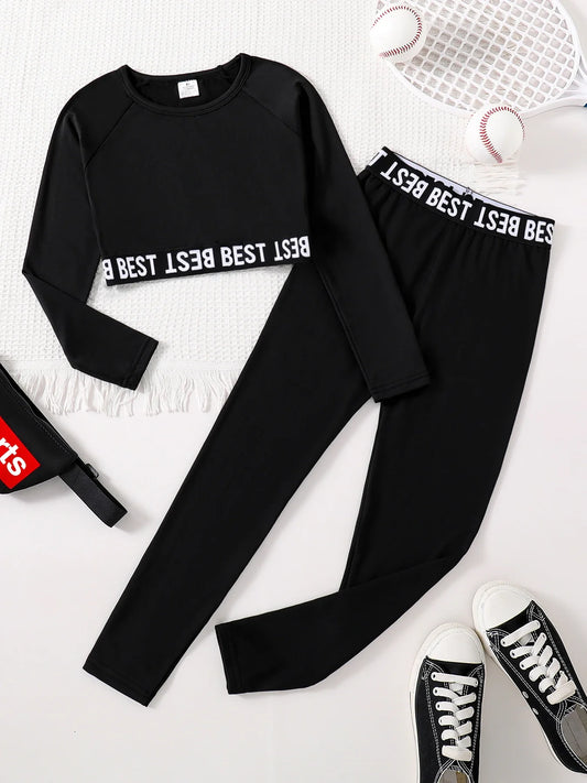 Chic girls' 2-piece fashion set featuring an elegant English print round neck long sleeve top and stylish slim fit black pants for ages 7-13, ideal for autumn with a thin polyester material.
