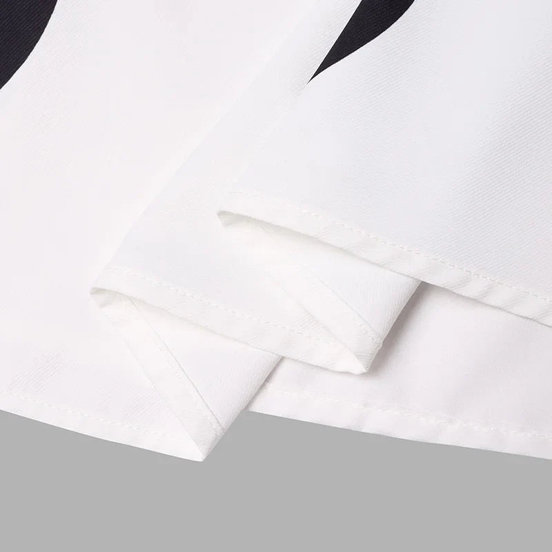 Close-up detail of the exquisite polka dot pattern on the VONDA Bohemian Maxi Dress, showcasing its premium fabric and luxurious finish.