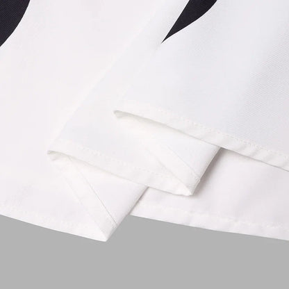 Close-up detail of the exquisite polka dot pattern on the VONDA Bohemian Maxi Dress, showcasing its premium fabric and luxurious finish.