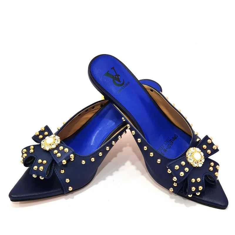 Luxurious women's high heeled shoes featuring a stylish rivet design in a vibrant colour, perfect for making a statement on any occasion.