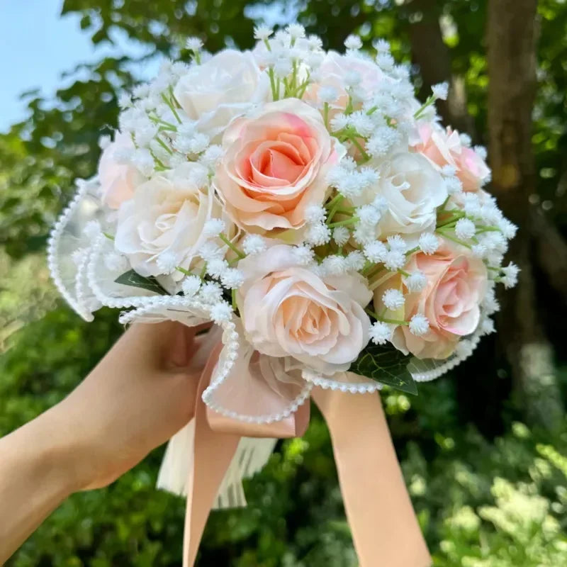 Sophisticated silk wedding bouquet in pastel tones, adorned with baby's breath and pearl lace, showcasing elegance for bridal celebrations.
