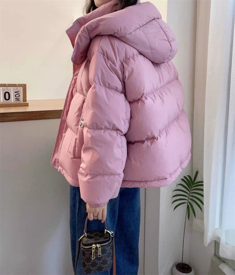 Stylish hooded women’s puffer coat showcasing a regular clothing length, tailored for a flattering fit in colder seasons.