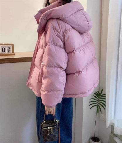 Stylish hooded women’s puffer coat showcasing a regular clothing length, tailored for a flattering fit in colder seasons.